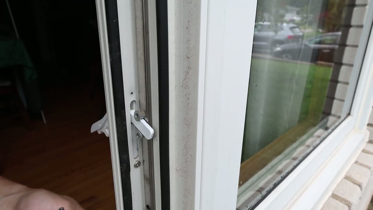 New multi-point locking handle seated in the jamb cutout with its mounting screws run snug