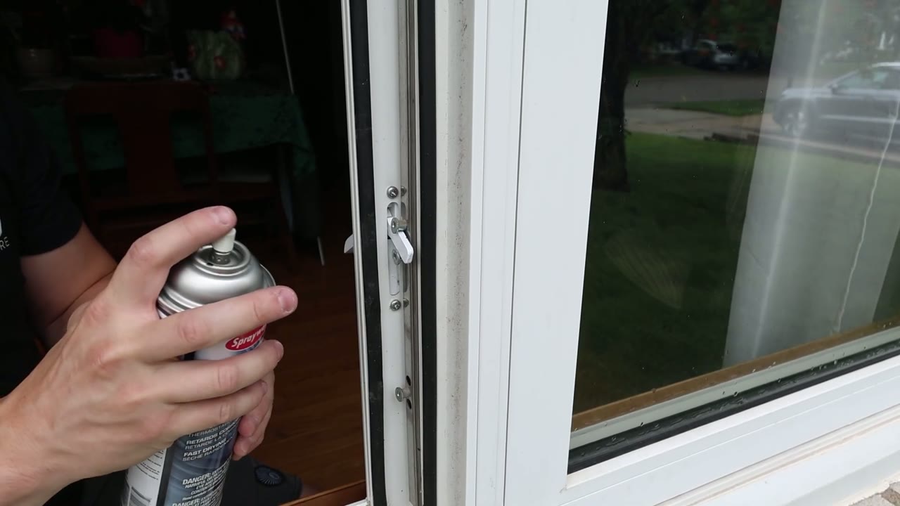 Sprayway silicone spray going onto the newly installed locking handle and tie bar