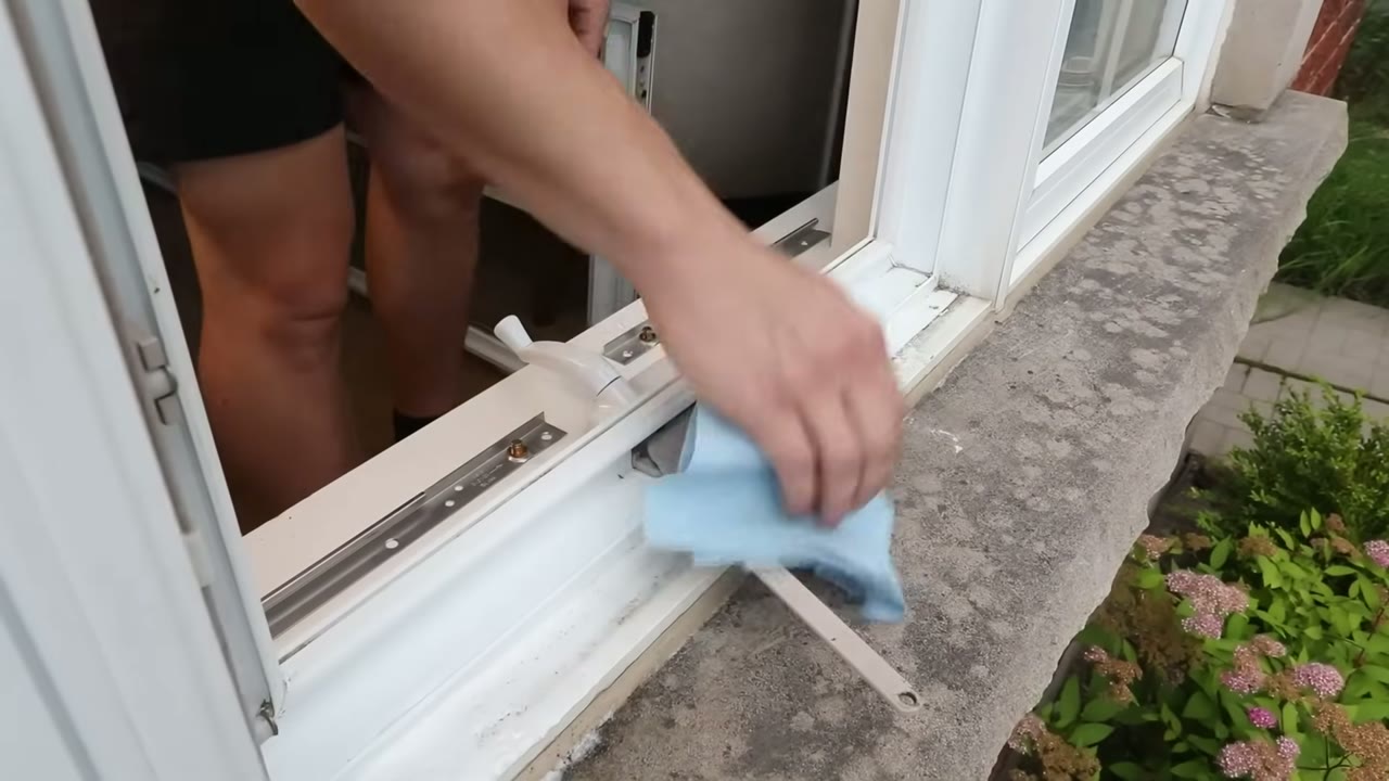 Sill and track wiped down before the sash goes back in — grit is what wears hinges out