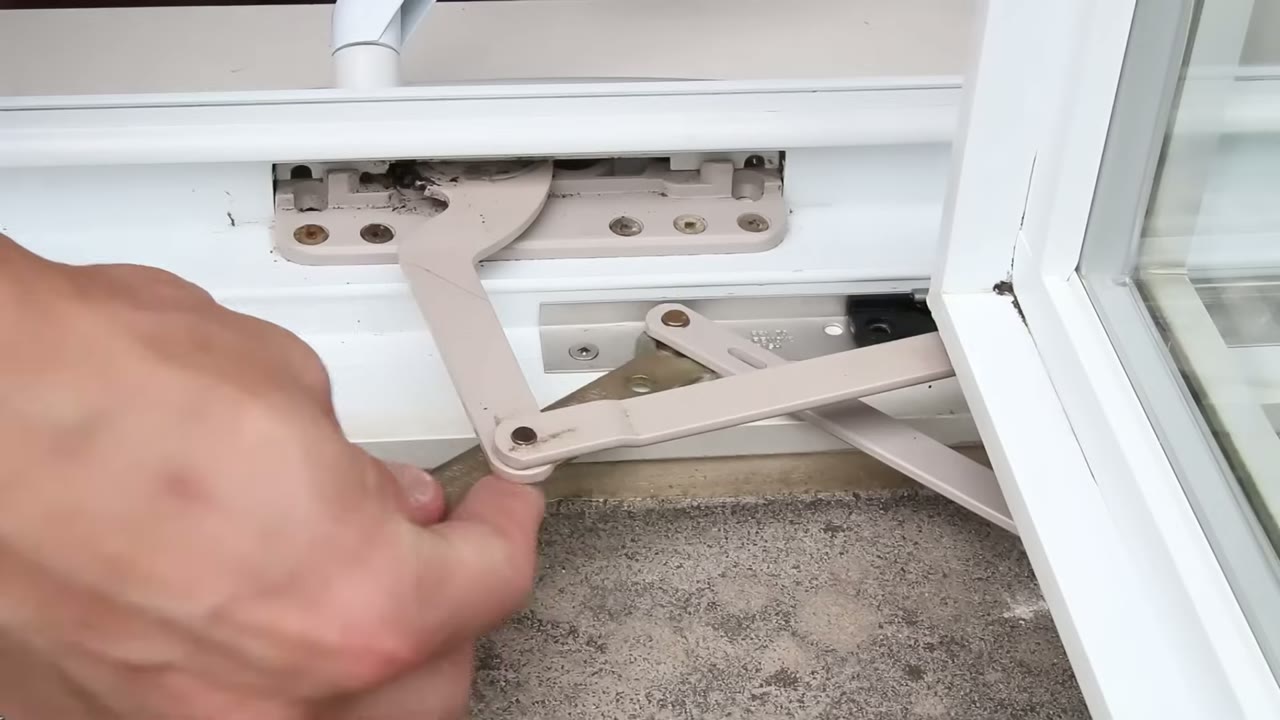 Truth slim-line wrench on the lower hinge stud — swing away from the lock side to lift the sash